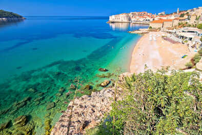 Dubrovnik. Banje beach and historic walls of Dubrovnik view, famous destination in Dalmatia region of Croatia
Dubrovnik. Banje beach and historic walls of Dubrovnik view, famous destination in Dalmatia region of Croatia