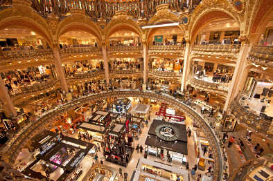 Galeries Lafayette interior in Paris. The architect Georges Chedanne designed the store where a Art Nouveau glass and steel dome was finished in 1912 Galeries Lafayette interior in Paris. The architect Georges Chedanne designed the store where a Art Nouveau glass and steel dome was finished in 1912