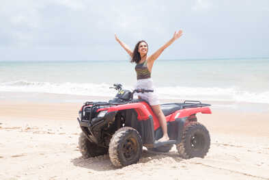A woman on a private guided quad tour A woman on a private guided quad tour