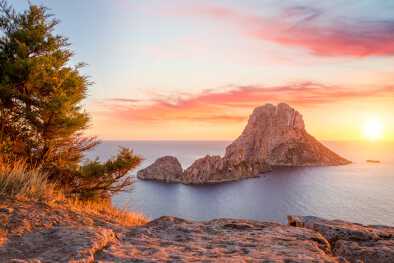 View of Es Vedrà from Ibiza at sunrise View of Es Vedrà from Ibiza at sunrise