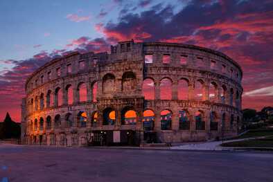 Sunset behind the Pula Amphitheatre in Croatia Sunset behind the Pula Amphitheatre in Croatia