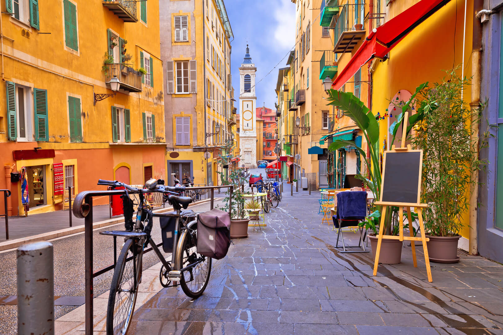 Beautiful colourful street architecture and view of the church, tourist destination of the French Riviera, Alpes Maritimes Ministry of France