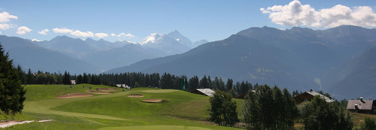 Golf course in the middle of the mountains at Crans Montana in Switzerland