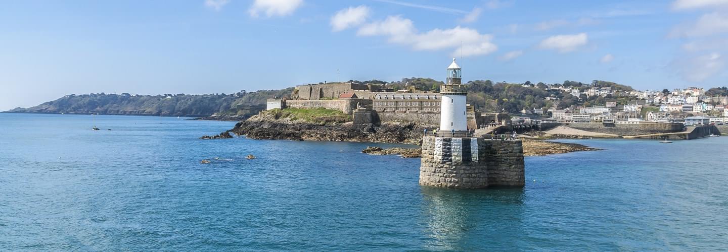 Entrance of Saint Peter Port on Guernsey Island with the Castle Cornet in background