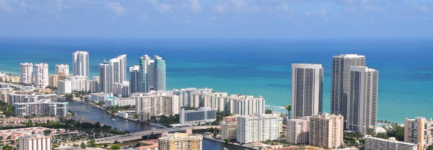 Sunny view of Miami West Palm Beach with skyscrapers and the sea and Collins canal