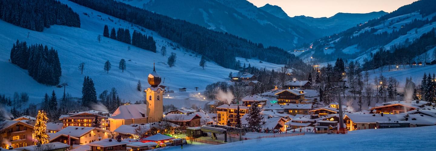 The town of Saalbach, an Austrian Alpine resort, at the front and the ski slopes at the back