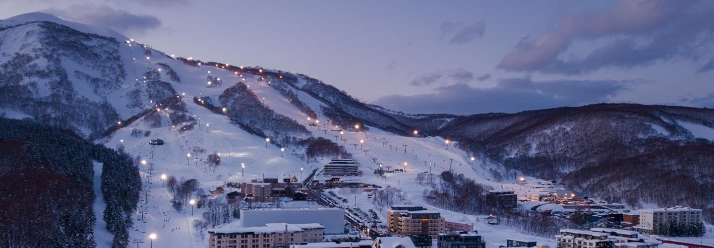 Aerial view of the ski slopes of Sapporo, Japan, in the evening darkness