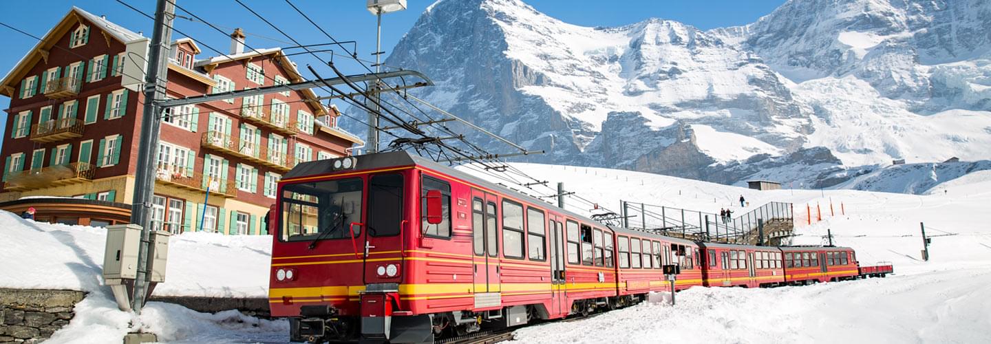 Photo of the train passing through the ski resort of Wengen in Switzerland