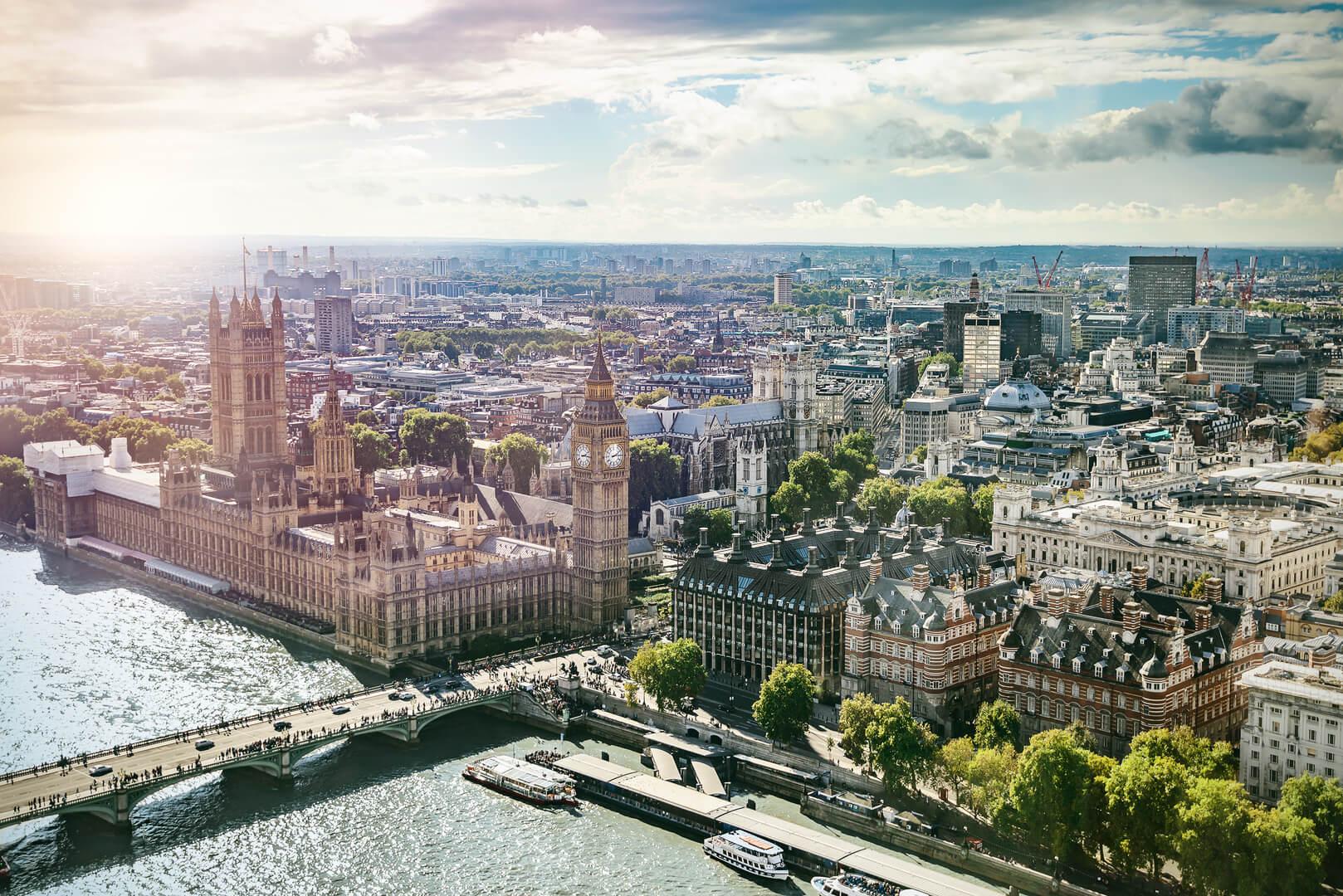 Aerial view of Big Ben, Parliament Building and Westminster Bridge on River Thames, with lens flare, London, UK, Europe