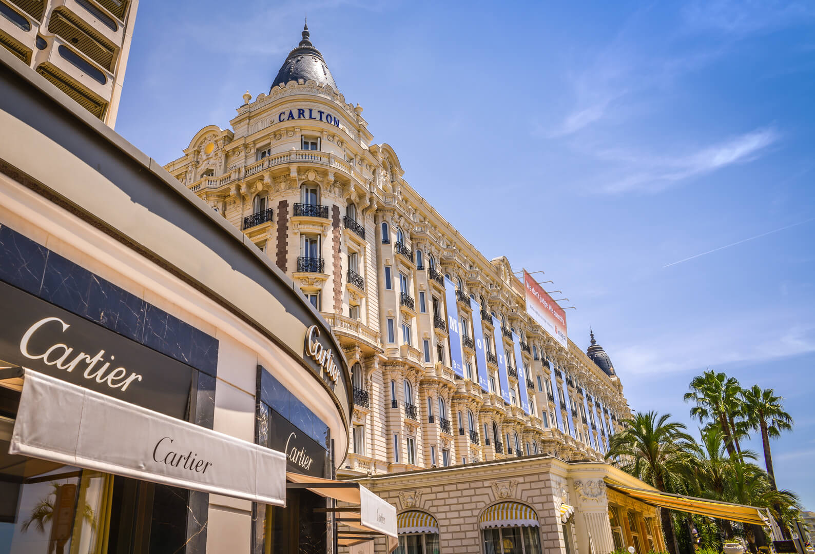 A general view of Hotel CARLTON CANNES and expensive shops along the Croisette.