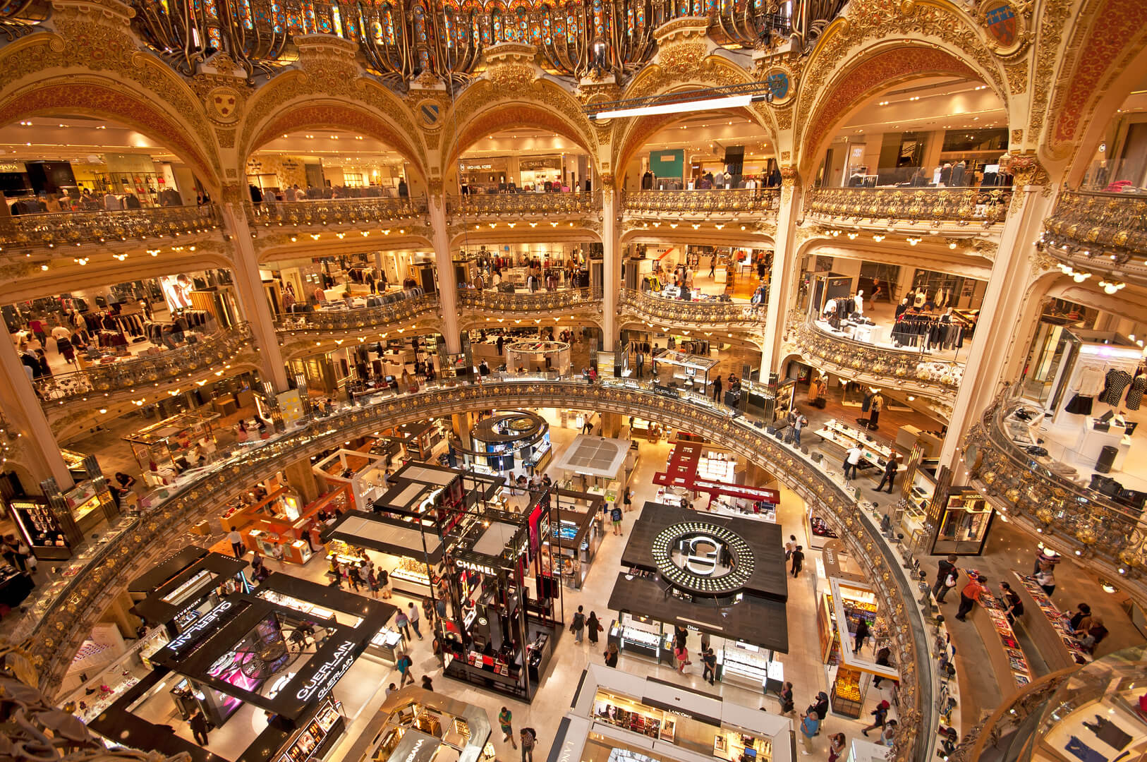 Galeries Lafayette interior in Paris. The architect Georges Chedanne designed the store where a Art Nouveau glass and steel dome was finished in 1912