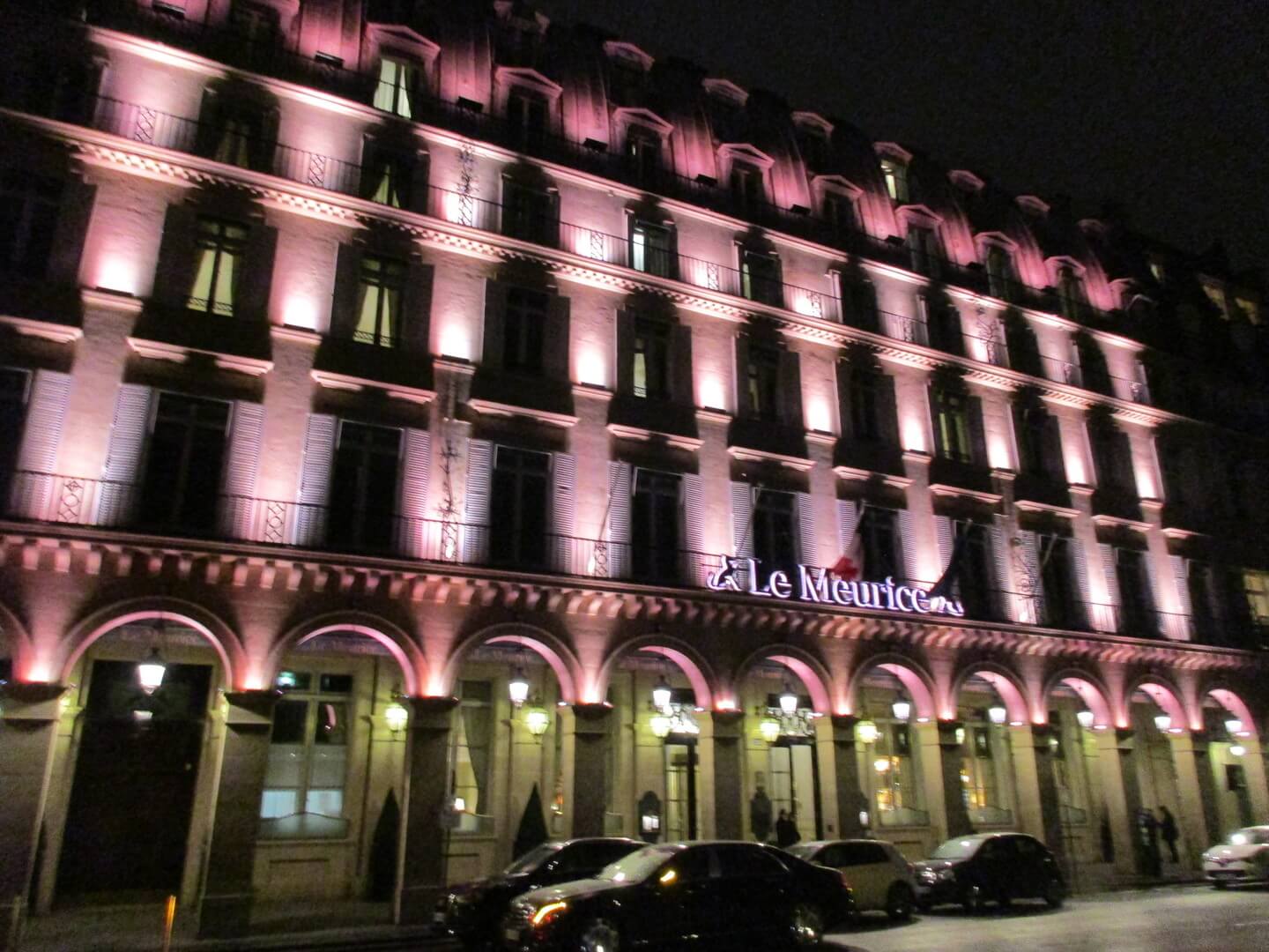 Front view of the Hotel Meurice in Paris at night, with superb lighting.