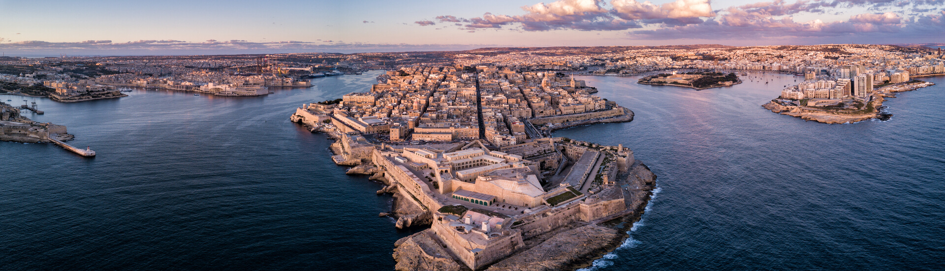 Aerial drone panorama sunrise photo - Ancient capital city of Valletta Malta. Island Country of Europe in the Mediterranean Sea