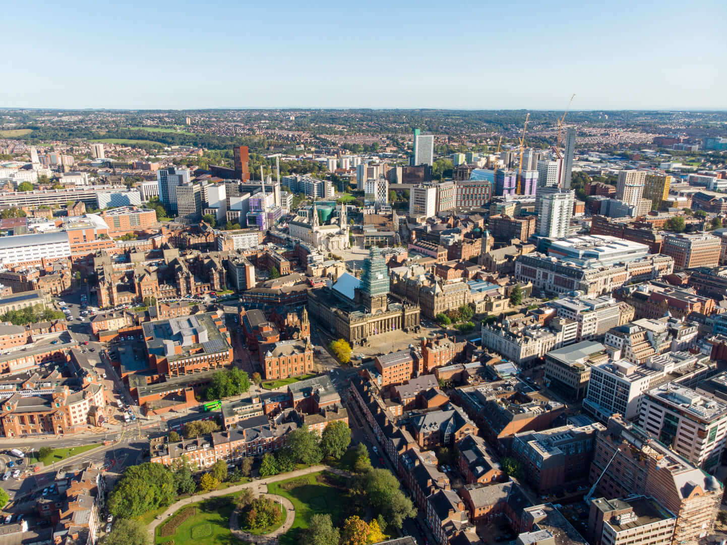 Aerial photo of the Leeds City Centre in West Yorkshire UK, showing business & hotels in the city centre, on a bright sunny day
