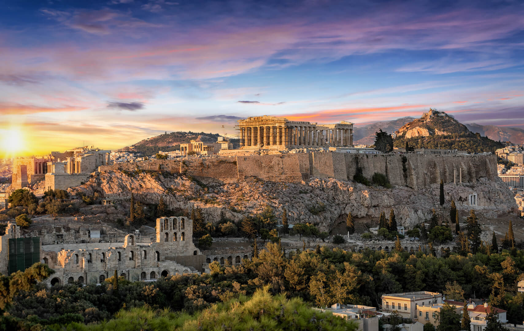 The Parthenon Temple at the Acropolis of Athens, Greece, during colorful sunset
