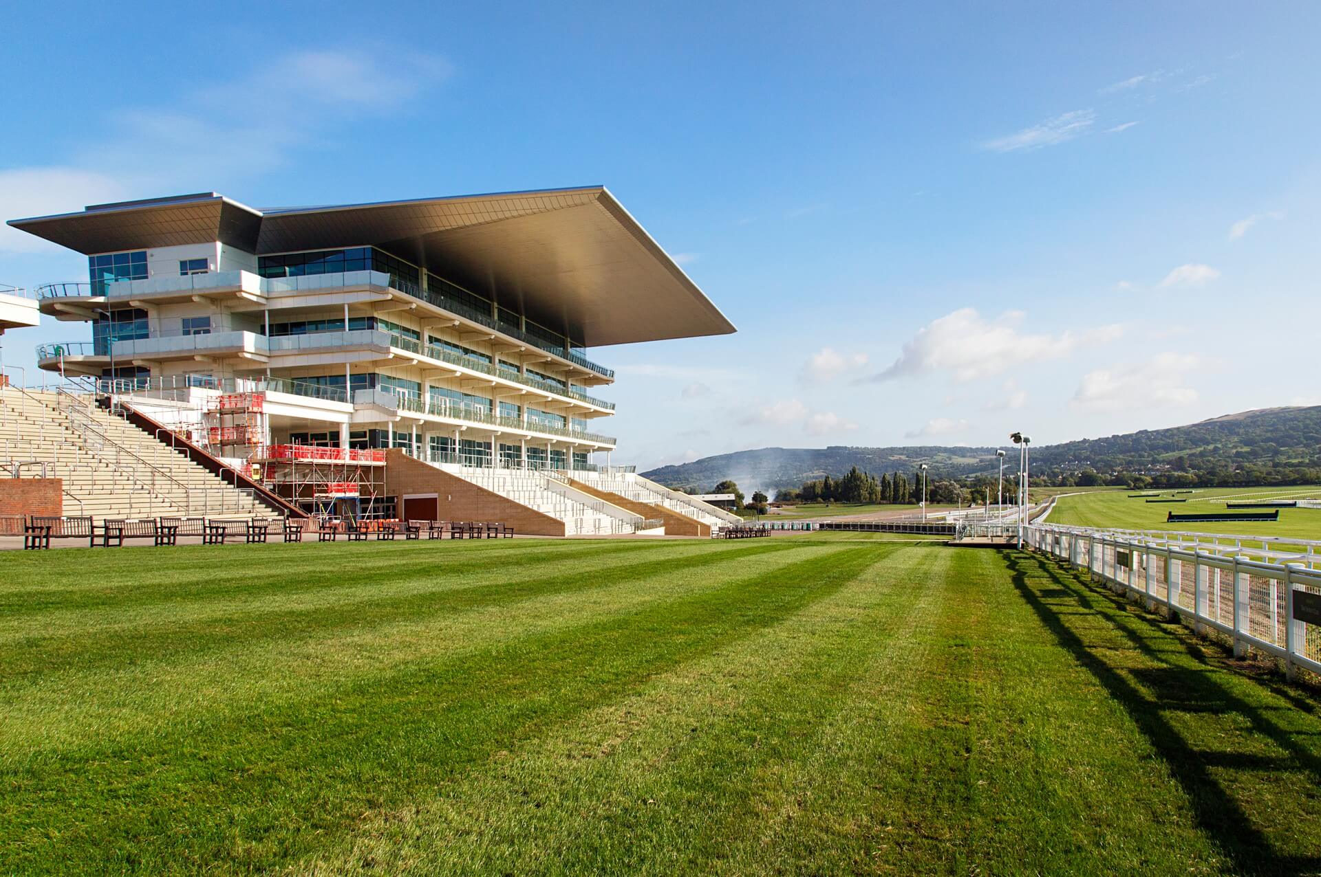 Cheltenham, UK The stands overlooking Cheltenham Racecourse located at Prestbury Park. The first organised Flat race meeting in Cheltenham took place in 1815 on Nottingham Hill.
