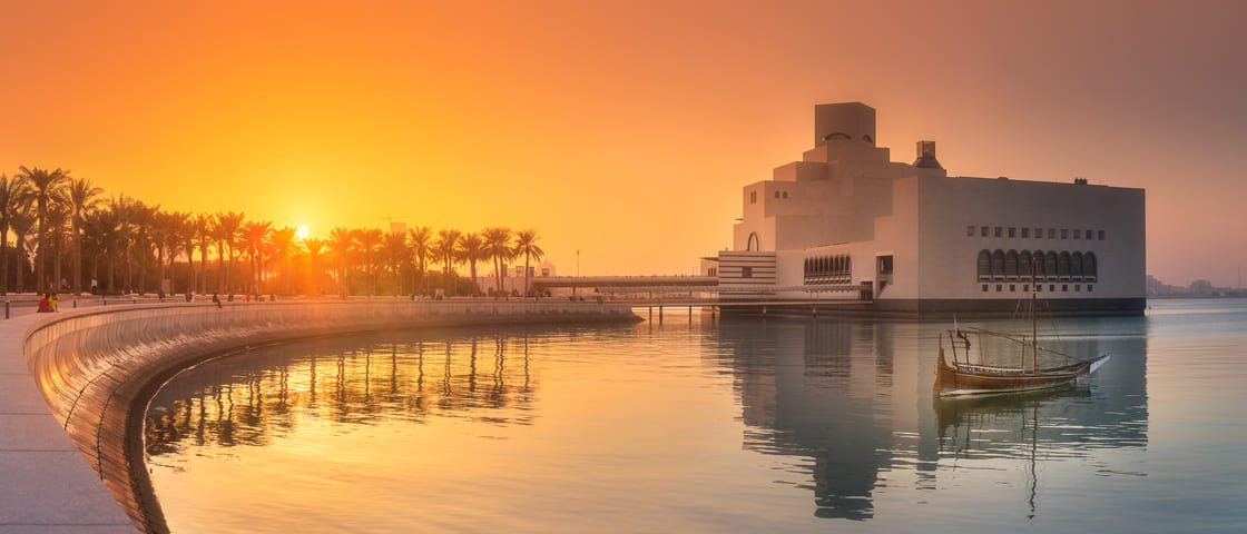 Seafront of Doha park and Museum of Islamic Art during sunset, Qatar.
