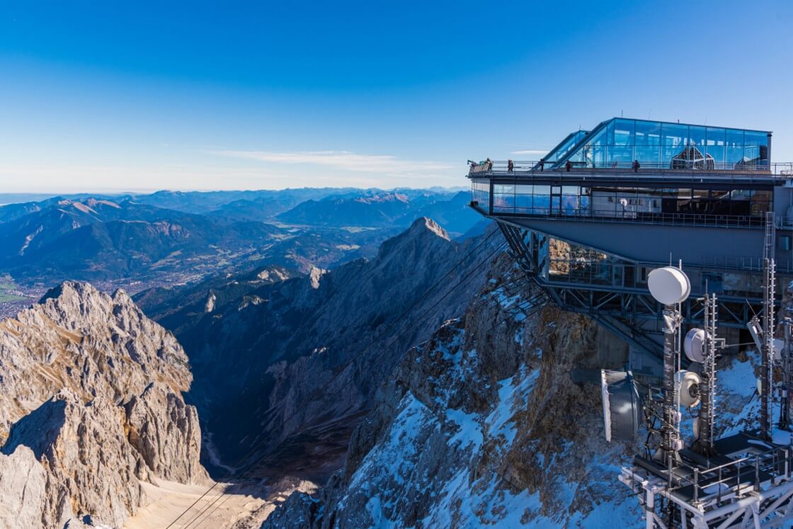 Top of Germany's highest peak-Zugspitze. The Zugspitze is the highest mountain in Germany and 2962m above sea level. We can see 360 degrees panorama and 400 mountain peaks in four countries.
