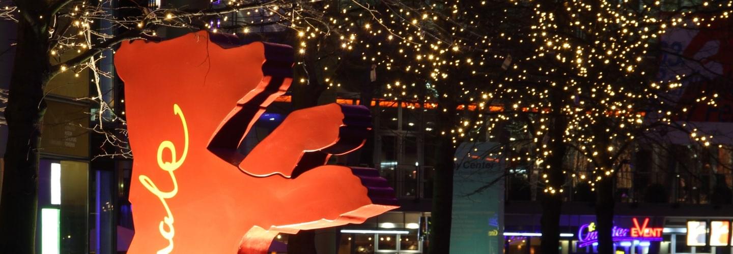 Berlinale Film Festival Awards red bear in Berlin Germany by night with light-up trees