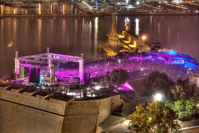 Concert by night illuminated with purple lights at the international music summit in Ibiza city center