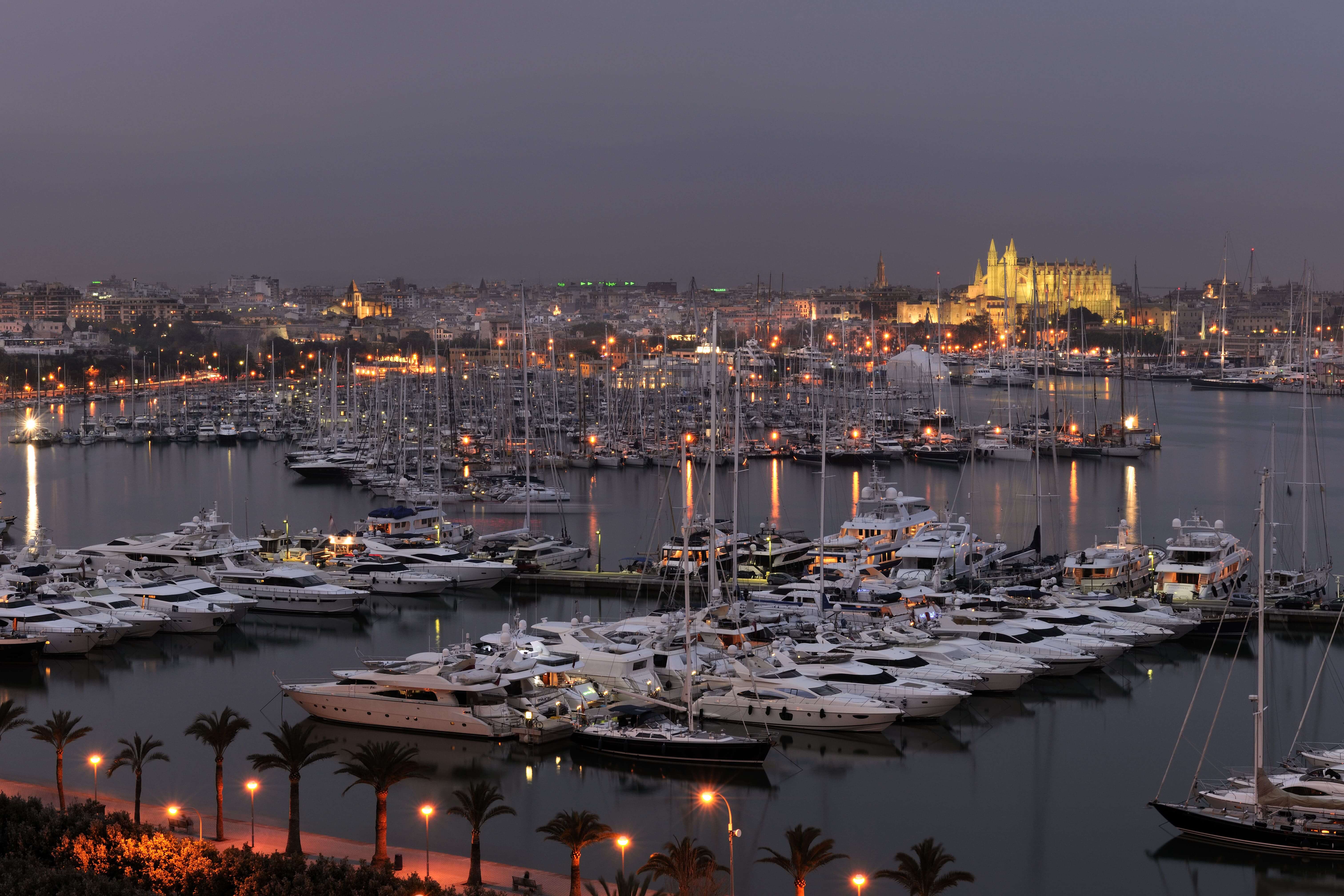 Evening view over the Bay of Palma and Club de Mar with La Seu cathedral in background