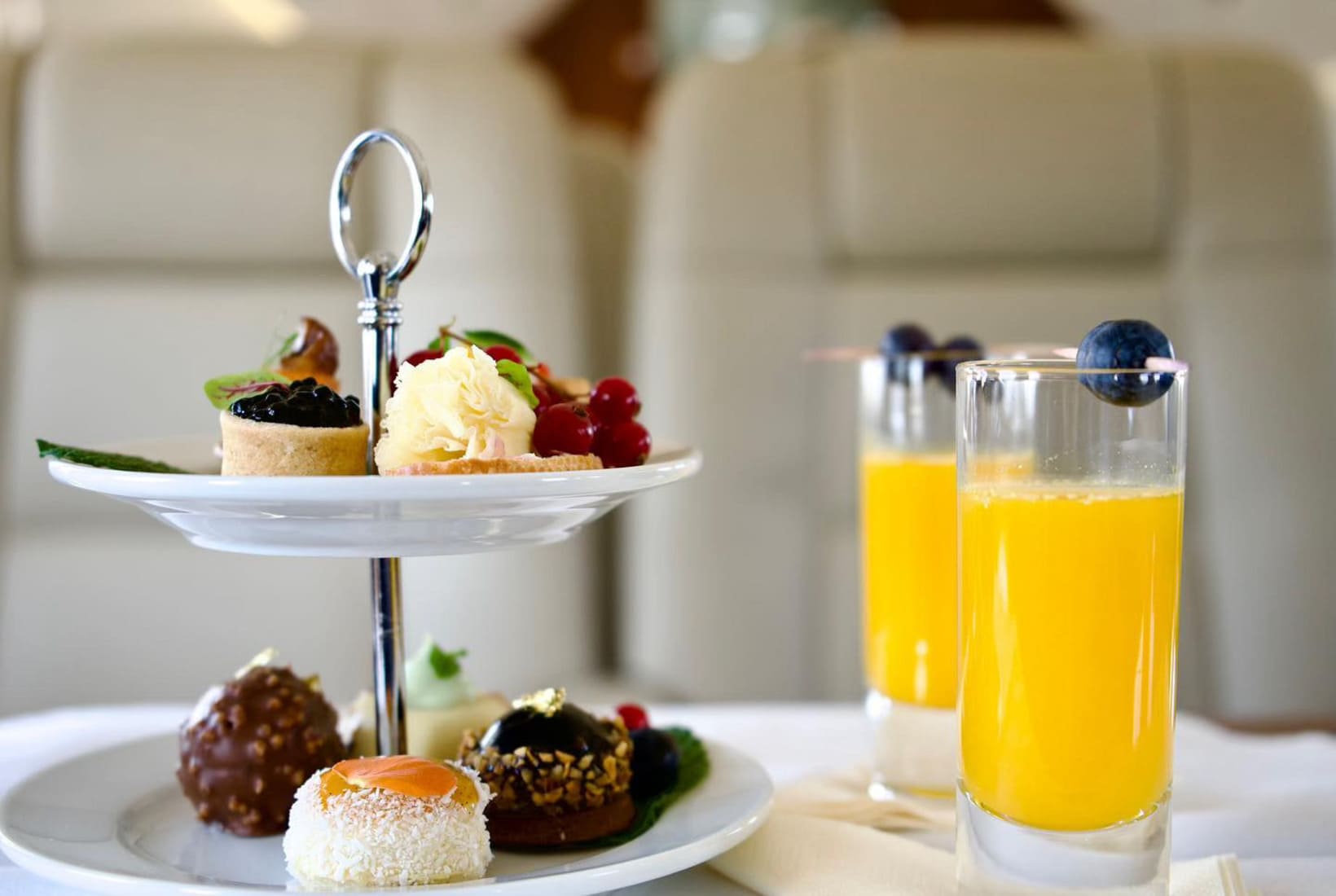 Small cake and drinks on a private jet
