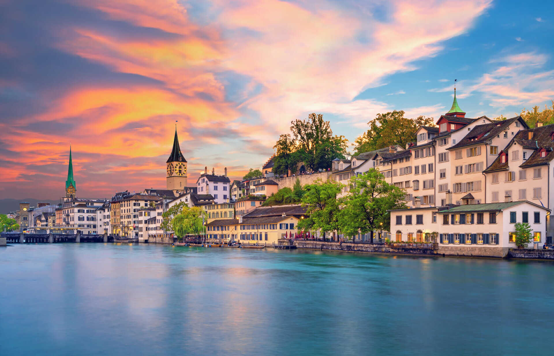 Scenic view of historic Zurich city center with famous Fraumunster and Grossmunster Churches and river Limmat at Lake Zurich, Canton of Zurich, Switzerland