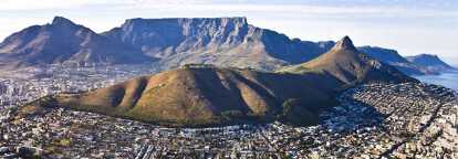 Aerial view of cape town in Africa with a hill in the center and a mountain in the background