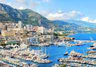 View by sunny daylight of the Hercule Port with yachts and boats and ferries in Monaco