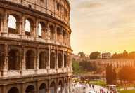 View of Rome with the colosseum on the left with sunset in the background