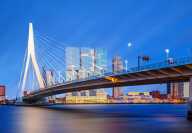 Night view of the Erasmusbrug bridge, The Swan, by Ben Van Berkel over the Nieuwe Maas in Rotterdam.