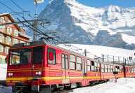 Photo of the train passing through the ski resort of Wengen in Switzerland