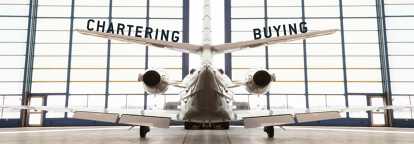 Private jet parked in a hangar