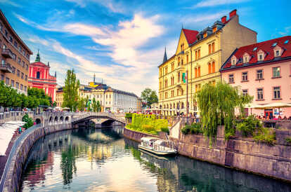 View of the cityscape on the Ljubljanica River canal in the Old Town of Ljubljana. Ljubljana is the capital of Slovenia and a famous European tourist destination.