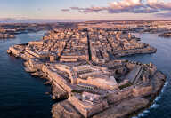 Aerial drone panorama sunrise photo - Ancient capital city of Valletta Malta. Island Country of Europe in the Mediterranean Sea