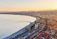 Sunset in Cannes with Promenade des Anglais and surrounding buildings and the Mediterranean sea!