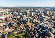 Aerial photo of the Leeds City Centre in West Yorkshire UK, showing business & hotels in the city centre, on a bright sunny day
