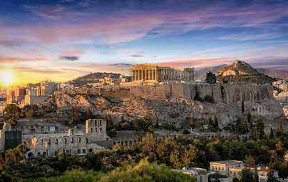 The Parthenon Temple at the Acropolis of Athens, Greece, during colorful sunset
