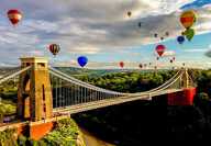 The international balloon fiesta is an annual event in Bristol. This photo captures the afternoon flight as the balloons come over the Clifton Suspension Bridge. 