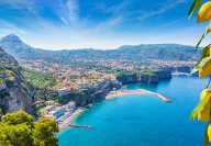 Aerial view of cliff coastline Sorrento and Gulf of Naples, Italy. Ripe yellow lemons in foreground. In Sorrento lemons are u
