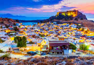 Rhodes, Greece. Lindos small whitewashed village and the Acropolis, scenery of Rhodos Island at Aegean Sea.
