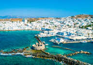 Ancient ruins of Venetian castle in the harbor of Naoussa town, view from above, Paros island, Greece
