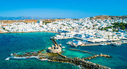 Ancient ruins of Venetian castle in the harbor of Naoussa town, view from above, Paros island, Greece

