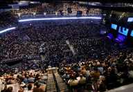 Large conference rooms filled with people for the Berkshire Hathaway Shareholders Meeting in Omaha Nebraska