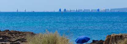 Blue sunshade with the copa del rey regatta in the background in Mallorca Spain