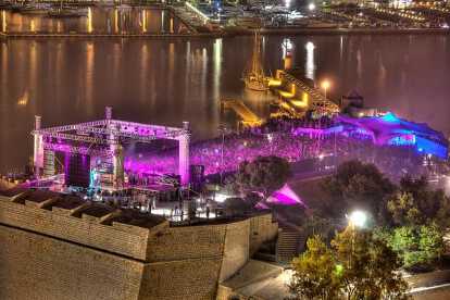 Concert by night illuminated with purple lights at the international music summit in Ibiza city center