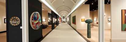 Alley of the international art fair Masterpiece in London with paintings and sculptures