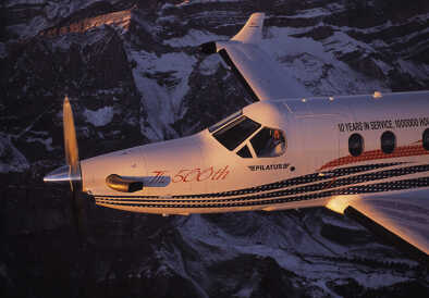 500th Pilatus PC-12 in flight over snow-covered mountains
