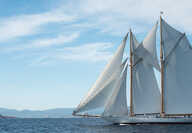 A boat on the blue sea at Voiles St Tropez in a sunny summer afternoon