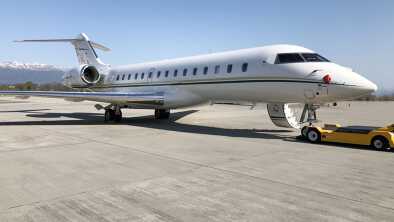 Bombardier Global Express 6000 in oblique view with folded out passenger stairs parked on the tarmac Bombardier Global Express 6000 in oblique view with folded out passenger stairs parked on the tarmac
